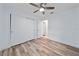 Bedroom features a ceiling fan, light wood laminate flooring, and a closet at 1188 La Mesa Ave, Winter Springs, FL 32708