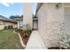 Close up front entry with landscaped walkway and charming facade at 1188 La Mesa Ave, Winter Springs, FL 32708