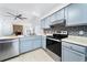 Modern kitchen with stainless appliances, stylish backsplash, and tile flooring at 1188 La Mesa Ave, Winter Springs, FL 32708