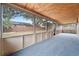 Screened lanai with carpet flooring and a wood ceiling at 1188 La Mesa Ave, Winter Springs, FL 32708