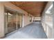 Screened lanai with carpet flooring and wood ceiling with view to bathroom at 1188 La Mesa Ave, Winter Springs, FL 32708