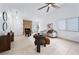 Inviting living room with stone fireplace, neutral colors, and tile floors at 1188 La Mesa Ave, Winter Springs, FL 32708