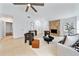 Bright living room featuring a cozy stone fireplace and neutral tones at 1188 La Mesa Ave, Winter Springs, FL 32708