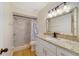 Bathroom featuring a walk-in shower and granite vanity top at 1248 Woodman Way, Orlando, FL 32818