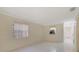 Bright living room featuring tiled floor and a view into the kitchen at 1248 Woodman Way, Orlando, FL 32818