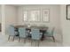 Elegant dining room featuring a large table with seating for eight at 12962 Promise Pl, Orlando, FL 32832