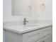 Close-up of a bathroom vanity with a quartz countertop, modern faucet, and gray shaker cabinets at 13283 Sw 30Th Terrace Rd, Ocala, FL 34473