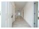 Entryway with light tile flooring leads into the home's living area, showcasing an open floorplan at 13283 Sw 30Th Terrace Rd, Ocala, FL 34473