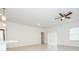 Spacious living room with ceiling fan, recessed lighting, and sliding door at 13283 Sw 30Th Terrace Rd, Ocala, FL 34473