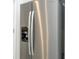 Close-up of a stainless steel refrigerator with water and ice dispenser, a modern kitchen appliance at 13283 Sw 30Th Terrace Rd, Ocala, FL 34473