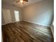 Spacious bedroom featuring wood floors, a ceiling fan, and neutral walls at 13745 Sw 43Rd Cir, Ocala, FL 34473