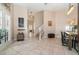 Inviting foyer boasts tile floors, neutral walls, staircase, and decorative accents leading to open living spaces and the dining room at 1428 Oberlin Ter, Lake Mary, FL 32746