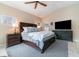 This is the main bedroom featuring a ceiling fan, television, and access to the backyard at 1428 Oberlin Ter, Lake Mary, FL 32746