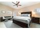 Spacious main bedroom with a ceiling fan, sitting area, and large windows for natural light at 1428 Oberlin Ter, Lake Mary, FL 32746