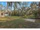 Large, tree-filled backyard offering plenty of room for outdoor activities and enjoying the natural surroundings at 1456 Helena Ct, Deltona, FL 32725