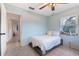 Comfortable bedroom featuring a ceiling fan and natural light at 1456 Helena Ct, Deltona, FL 32725