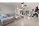 Bright and airy living room showcasing terrazzo floors and a seamless open-concept design at 1456 Helena Ct, Deltona, FL 32725