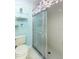 Well-lit bathroom with a glass-enclosed shower and functional fixtures at 15204 Margaux Dr, Clermont, FL 34714