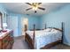 Comfortable bedroom featuring a classic wooden bed frame and ample natural light at 15204 Margaux Dr, Clermont, FL 34714