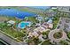 Aerial view showcasing the community amenities including pools, splashpad, and lush landscaping at 1547 Carey Palm Cir, Kissimmee, FL 34747