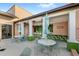 Outdoor bar area with unique tiling, patio tables, and shade umbrellas, ideal for socializing at 1547 Carey Palm Cir, Kissimmee, FL 34747