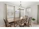 Cozy dining room with a wooden table and natural lighting at 1547 Carey Palm Cir, Kissimmee, FL 34747