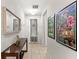 Inviting hallway featuring tile floors and stylish decor at 1547 Carey Palm Cir, Kissimmee, FL 34747