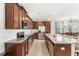 Bright kitchen with stainless steel appliances and a granite countertop island at 1547 Carey Palm Cir, Kissimmee, FL 34747