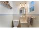 Charming bathroom features a sink, toilet and a decorative shelf with natural lighting from the window at 1585 Chestnut Ave, Winter Park, FL 32789