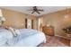 Spacious bedroom features tile floors, ceiling fan, and access to ensuite bath and walk-in closet at 1585 Chestnut Ave, Winter Park, FL 32789