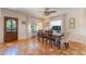 Elegant dining room with wood table, light colored chairs, and detailed tile floor at 1585 Chestnut Ave, Winter Park, FL 32789