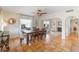 Bright dining room featuring a ceiling fan, large windows, and unique tile flooring at 1585 Chestnut Ave, Winter Park, FL 32789