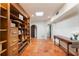 Bright entryway featuring a large bookshelf and decorative console table at 1585 Chestnut Ave, Winter Park, FL 32789