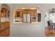 Open kitchen view featuring wood cabinets and a breakfast bar at 1585 Chestnut Ave, Winter Park, FL 32789