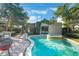 Backyard pool and spa with mature landscaping, creating a private and luxurious outdoor space at 1585 Chestnut Ave, Winter Park, FL 32789