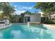 Backyard pool and spa with mature landscaping, creating a private and luxurious outdoor space at 1585 Chestnut Ave, Winter Park, FL 32789