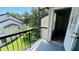 Private balcony with black railings overlooks lush greenery, providing a serene outdoor retreat at 1932 Lake Atriums Cir # 74, Orlando, FL 32839