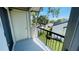 Balcony with black railings offers views of the street and surrounding neighborhood, plus extra storage at 1932 Lake Atriums Cir # 74, Orlando, FL 32839