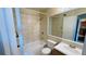 Bathroom featuring a tiled shower and bathtub combo, toilet, and vanity at 1932 Lake Atriums Cir # 74, Orlando, FL 32839