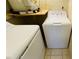 Functional laundry room features a washer and dryer for convenient in-unit laundry, plus a water heater at 1932 Lake Atriums Cir # 74, Orlando, FL 32839