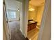 Well-lit bathroom featuring a single sink vanity and an adjacent bedroom space at 1940 Lake Atriums Cir # 108, Orlando, FL 32839