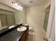 Functional bathroom featuring a vanity with a sink, a large mirror, and essential fixtures at 1940 Lake Atriums Cir # 108, Orlando, FL 32839