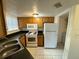 Well-lit kitchen featuring essential appliances and cabinetry, ready for meal preparation at 1940 Lake Atriums Cir # 108, Orlando, FL 32839