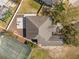 Aerial view of a home featuring a tennis court, swimming pool, and patio within a fenced backyard at 1946 Thoroughbred Dr, Gotha, FL 34734