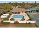 Aerial view of community pool and playground area, providing recreation and leisure for residents at 1946 Thoroughbred Dr, Gotha, FL 34734