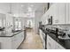 Kitchen featuring granite countertops, stainless steel appliances, and an open layout leading to the dining area at 1946 Thoroughbred Dr, Gotha, FL 34734