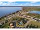 Lovely aerial view of houses near a beautiful pool and scenic waterfront at 1990 Appalachee Cir, Tavares, FL 32778