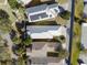 Bird's-eye view showcasing the metal roof and the home's position among other well-kept houses at 1990 Appalachee Cir, Tavares, FL 32778