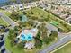 Community aerial view showcasing the pool, tennis court, and recreational facilities at 1990 Appalachee Cir, Tavares, FL 32778