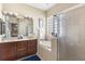 Luxurious bathroom boasts double vanity sinks, soaking tub, and walk-in shower at 1990 Appalachee Cir, Tavares, FL 32778